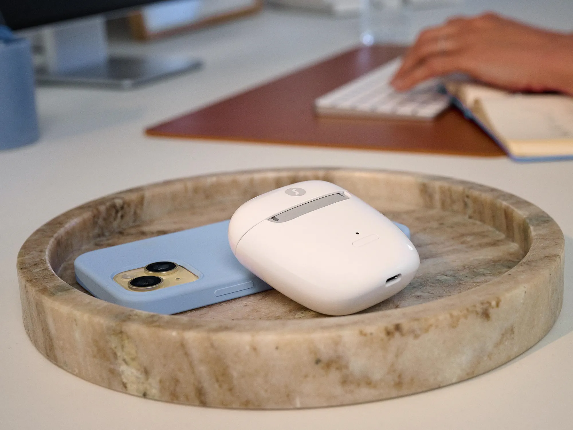 Work environment showcasing a Signia hearing case.