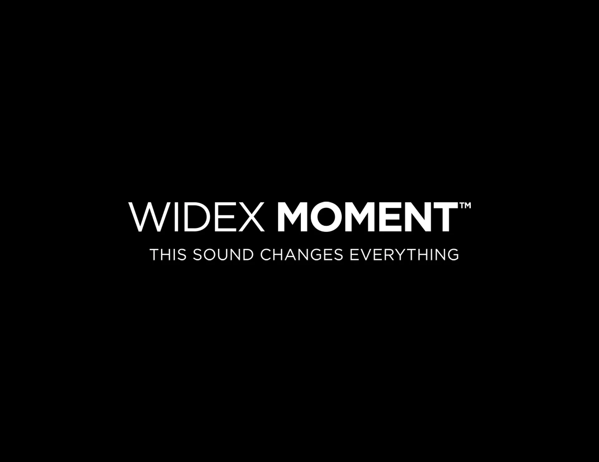 Logótipo do Widex Moment em fundo preto.