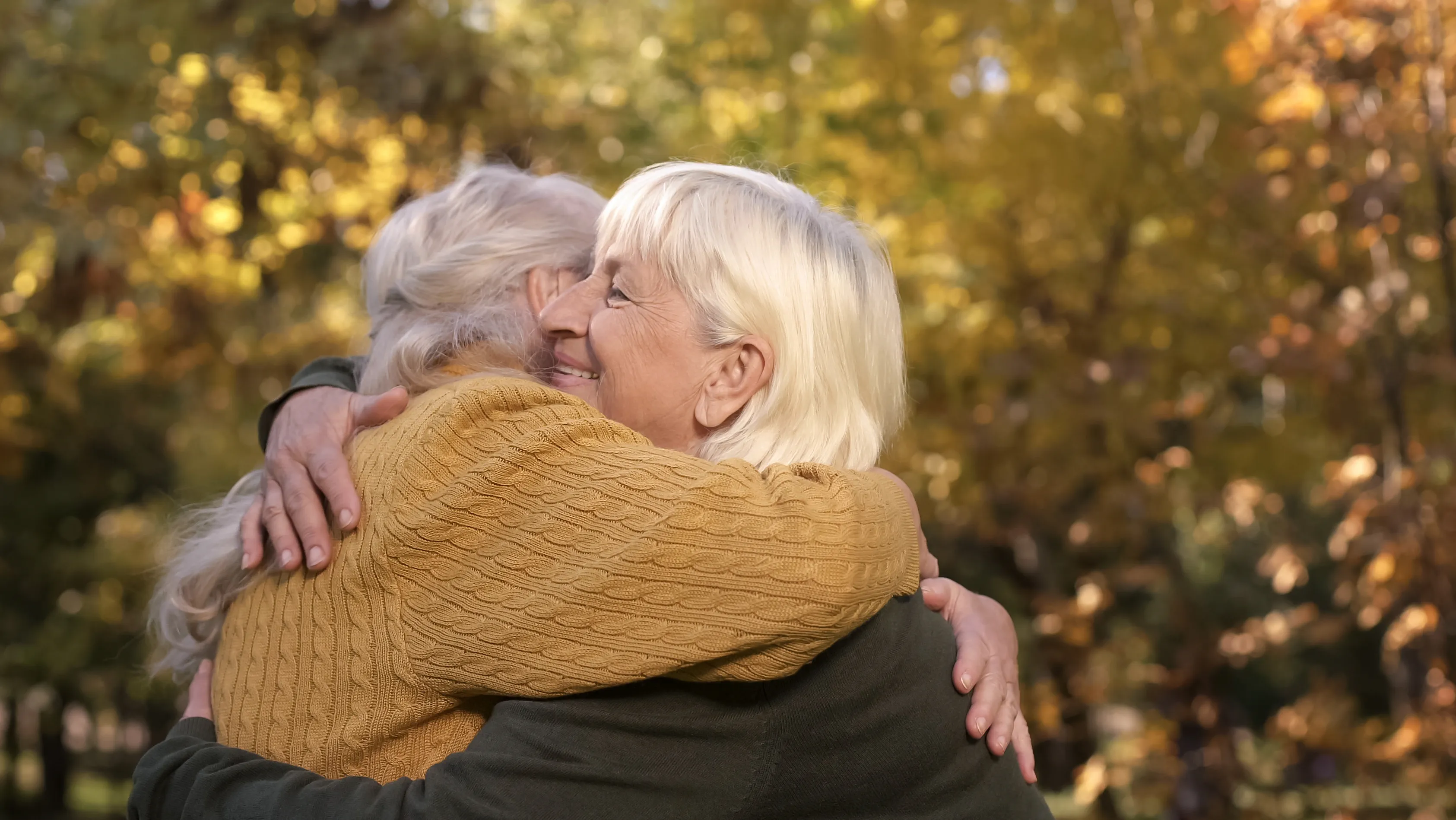 elderly-friends-outside-hearing-aids-16x9
