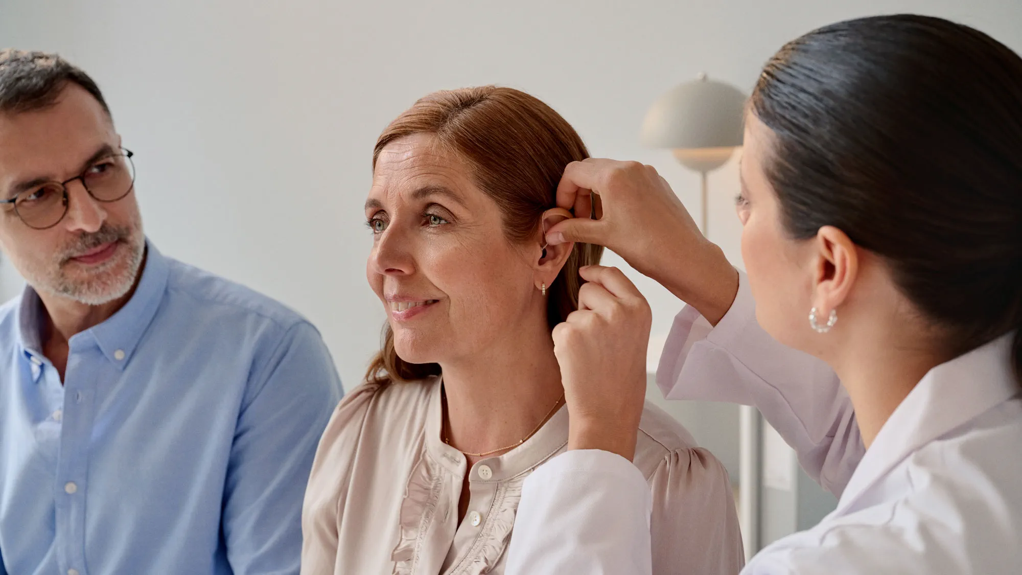 fitting-hearing-aid-hearing-appointment-coat-16x9