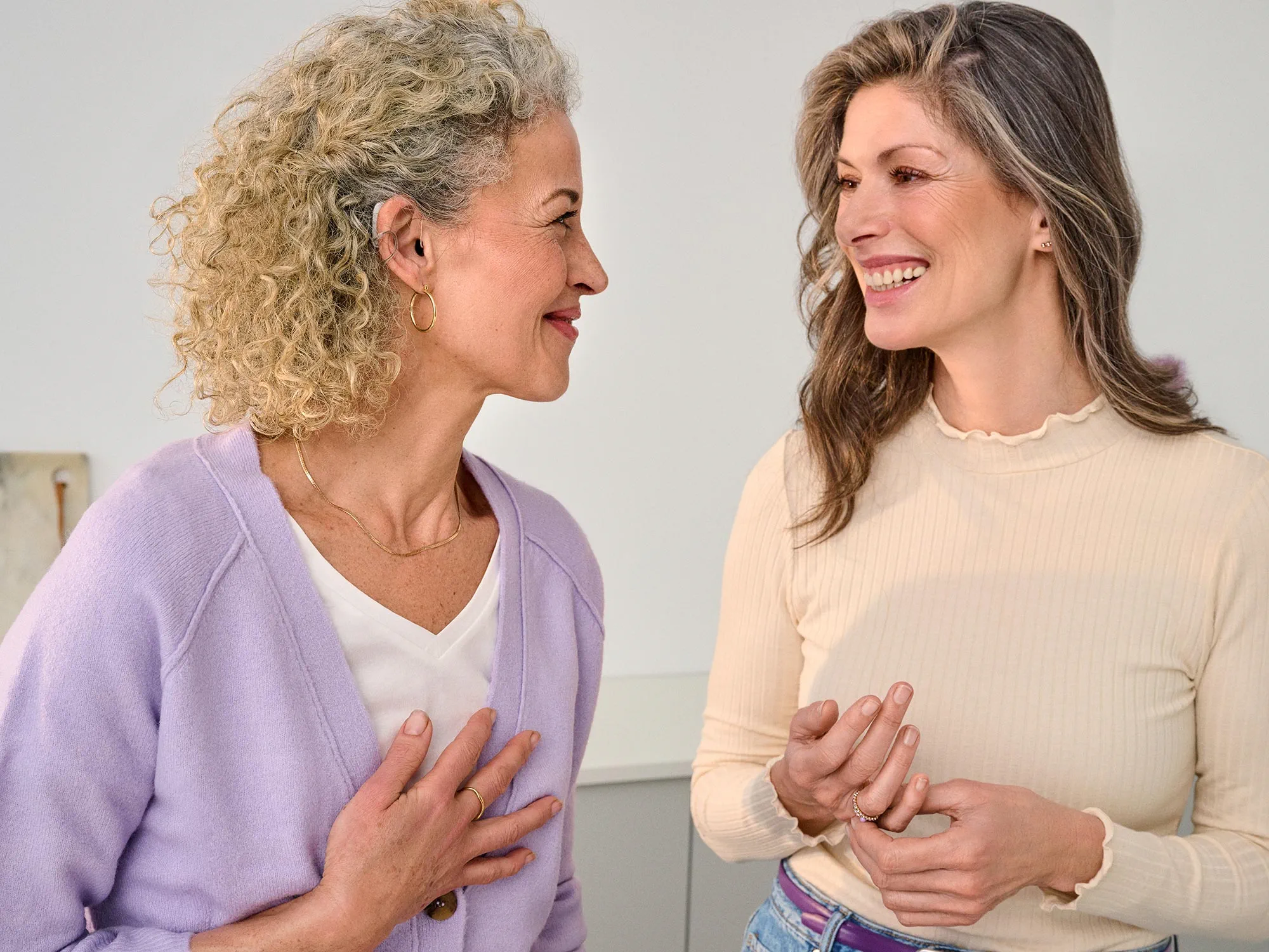 friends-talking-close-hearing-aids-4x3