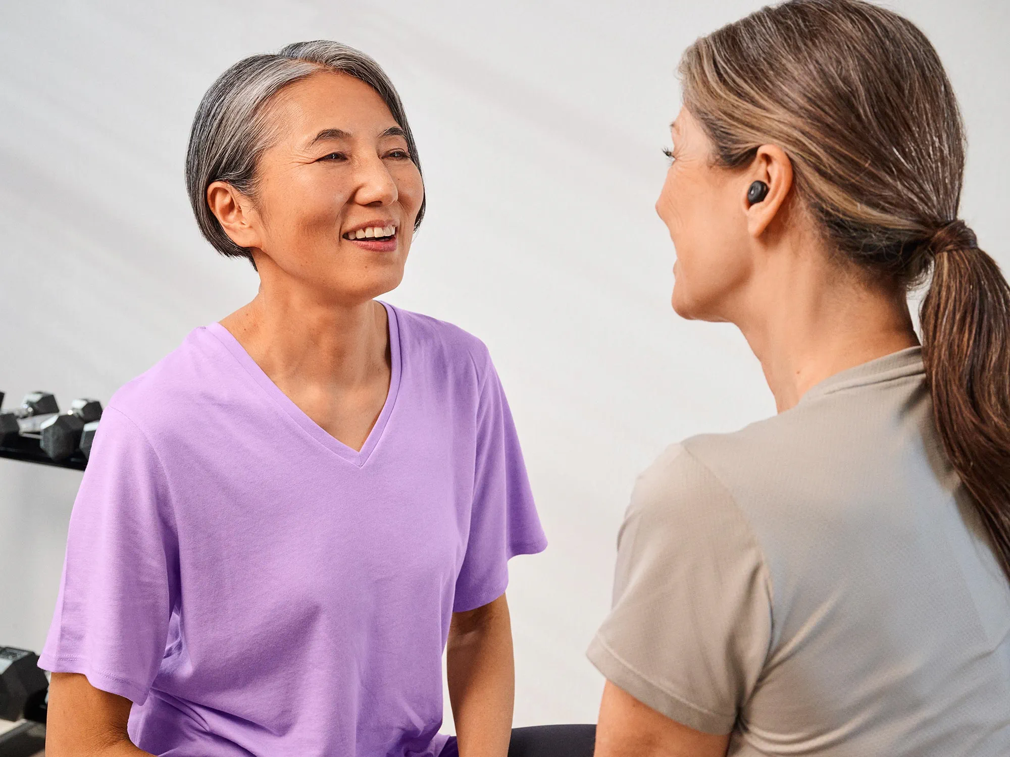 gym-friends-talking-hearing-loss-4x3