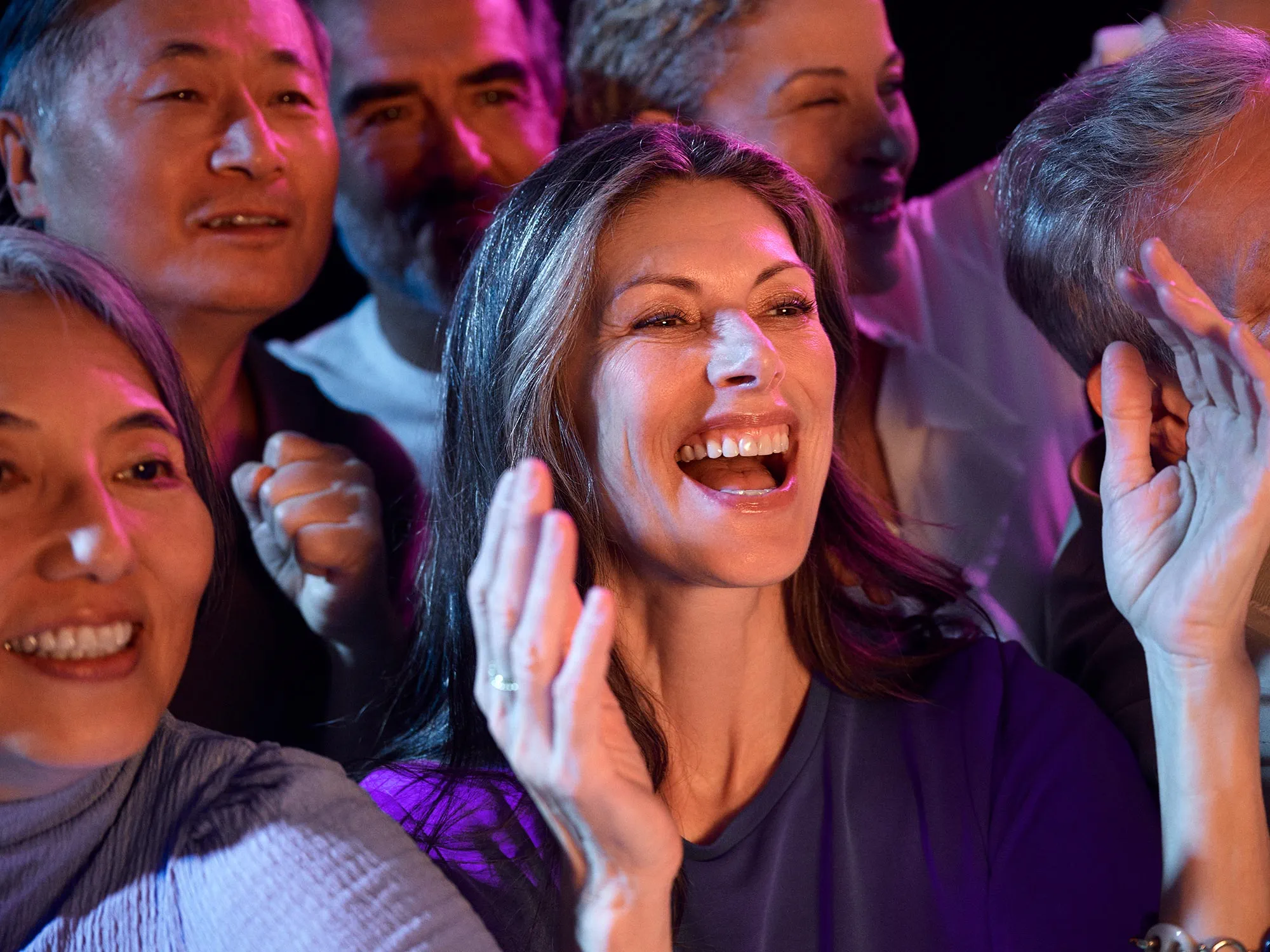 woman-concert-clapping-hearing-improvement-4x3
